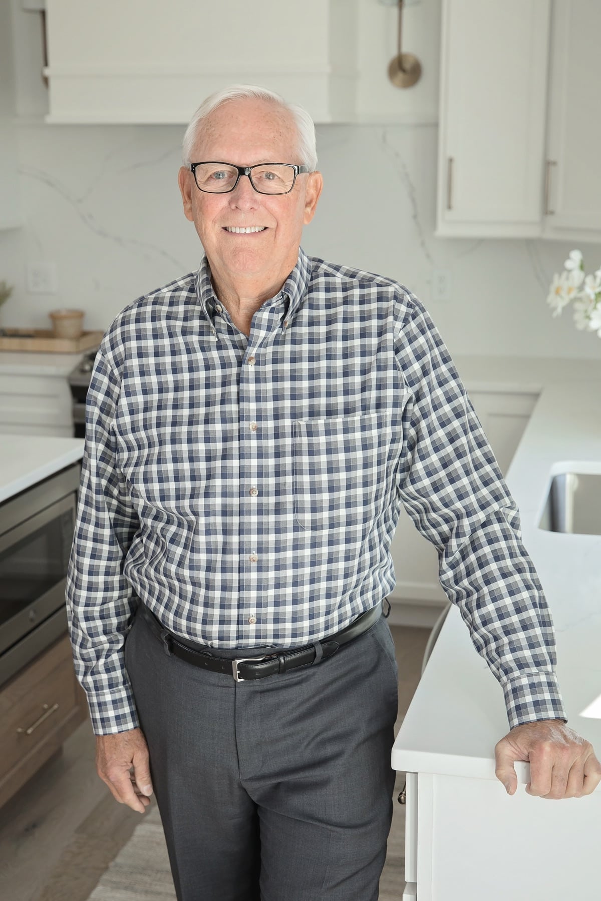 Russ Taylor, Champaign IL real estate agent, smiling in a modern kitchen