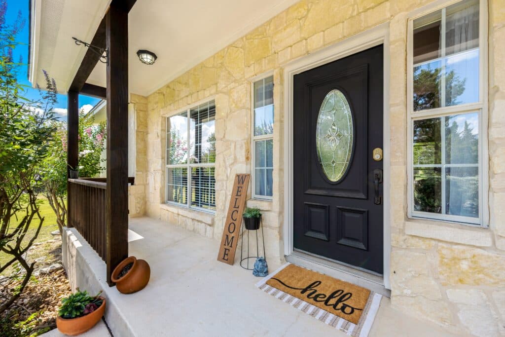 https://claude.ai/chat/adb0b277-f10b-4fe4-9fa7-fe2d9c94da15#:~:text=Complete%20Your%20Home%20Inspection Stone home front porch with a black door, "hello" welcome mat, and potted plants.
